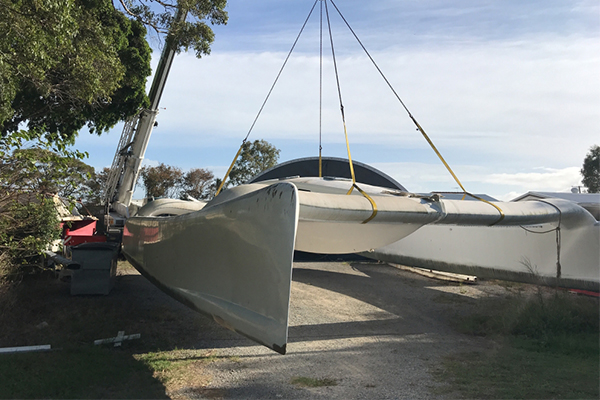 A pair of mobile cranes in the Gold Coast have transported one of the fastest speedboats in Australia from a holding yard at Stieglitz Wharf in Jacobs Wells