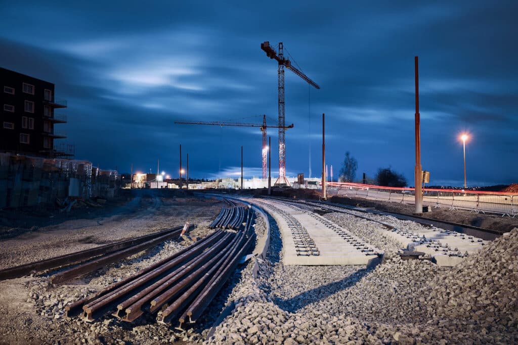 Construction site of railroad track. Building of new tram connection in city.